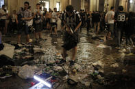 <p>Juventus’ supporters look for personal belongings in Piazza San Carlo after a panic movement in the fanzone where thousands of Juventus fans were watching the UEFA Champions League Final football match between Juventus and Real Madrid on a giant screen, on June 3, 2017 in Turin. (Massimo Pinca/AFP/Getty Images) </p>