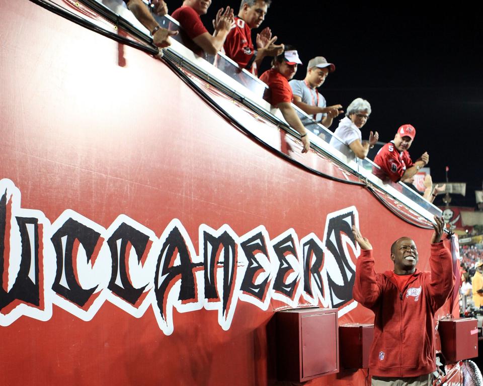 TAMPA, FL - OCTOBER 03:  Coach Raheem Morris of the Tampa Bay Buccaneers greets fans prior to facing the Indianapolis Colts at Raymond James Stadium on October 3, 2011 in Tampa, Florida.  (Photo by Marc Serota/Getty Images)