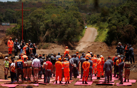 Rescue workers attend a mass for victims victims of a collapsed tailings dam owned by Brazilian mining company Vale SA, in Brumadinho, Brazil February 1, 2019. REUTERS/Adriano Machado