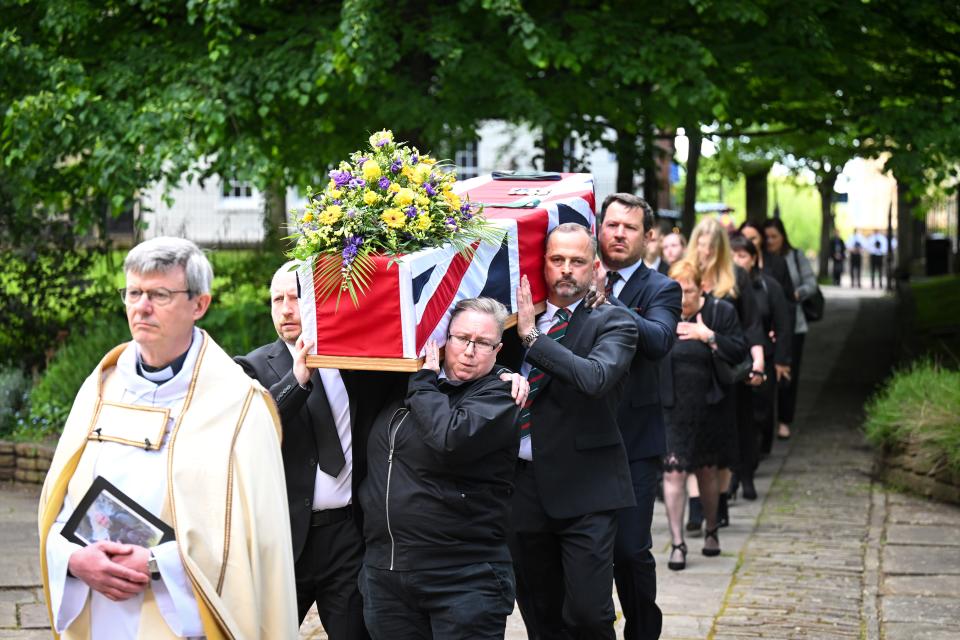 A funeral procession carries the coffin of James Kirby into St. Mary Redcliffe Church on May 15, 2024, in Bristol, England. Kirby was one of seven World Central Kitchen workers killed when their vehicles were targeted by Israeli military strikes.