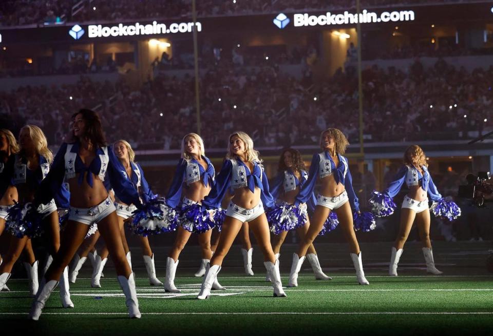 The Dallas Cowboys Cheerleaders perform with Dolly Parton during the Dallas Cowboys’ halftime show to kickoff the Red Kettle Campaign on Thursday, November 23, 2023, at AT&T Stadium in Arlington. Amanda McCoy/amccoy@star-telegram.com