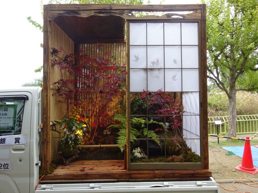 a window with a flower arrangement