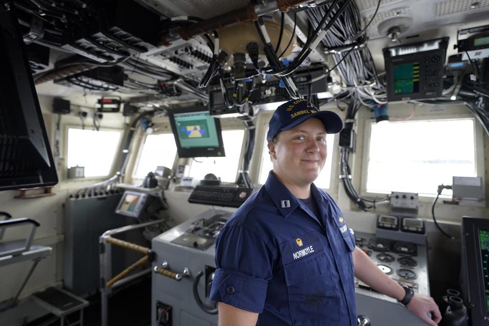 U.S. Coast Guard Lt. Kelli Normoyle, Commanding Officer of the Coast Guard Cutter Sanibel, stands for a photograph on the bridge of the vessel, Thursday, Sept. 16, 2021, at a shipyard in North Kingstown, R.I. Normoyle was one of two cadets who formally started the process to create the CGA Spectrum Diversity Council just a few months after the law known as "don't ask, don't tell" was repealed on Sept. 20, 2011. (AP Photo/Steven Senne)