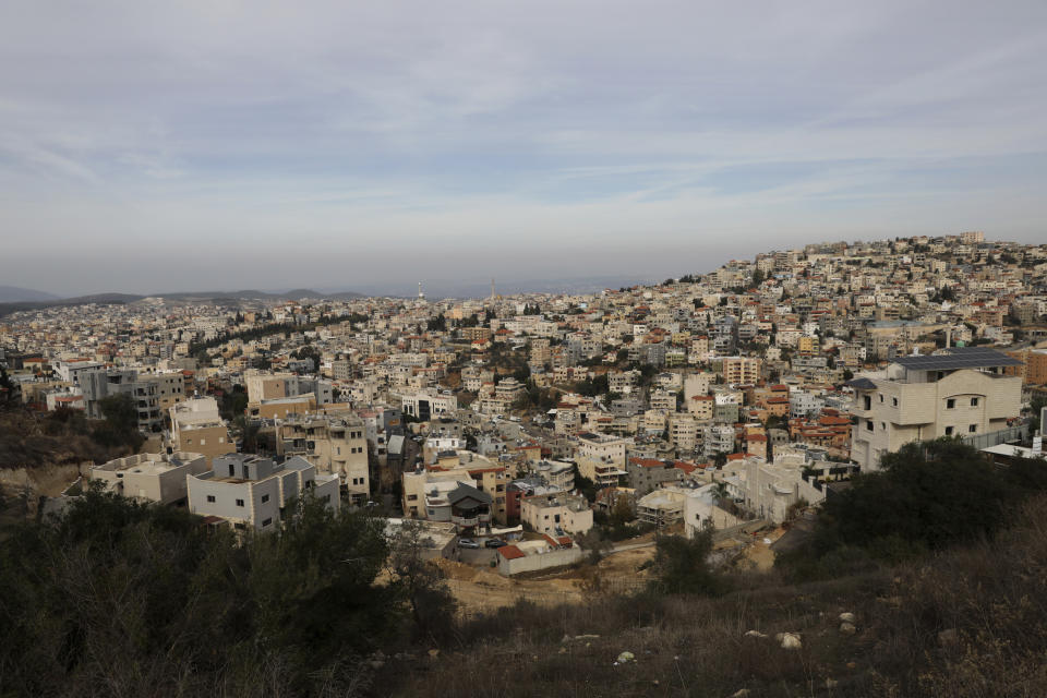 A general view of Umm el-Fahm, Israel, Friday, Dec. 3, 2021, after a man was shot dead by Israeli police in a car-ramming incident following a night of intense violence in an Arab populated Israeli town. (AP Photo/Mahmoud Illean)