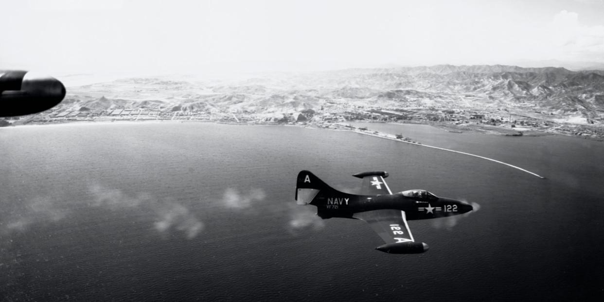 A Grumman F9F Panther fighter jet fires its guns during an attack on the North Korean port of Hungnam.