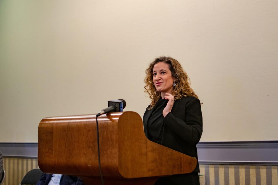 Maycomb Capital managing director Shelby Kohn speaks at a Friday news conference on the "pay for success" program her group is funding to provide permanent supportive housing to the state's homeless population.