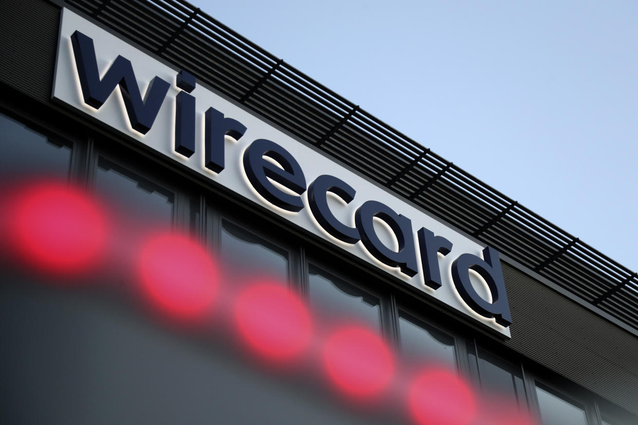 The logo of payment company Wirecard is pictured at the headquarters in Munich, Germany, Monday, July 20, 2020. Underscoring the impact of the scandal, the finance committee in Germany's lower house of parliament plans to interrupt the summer recess to hold a special session on July 29 to discuss Wirecard. (AP Photo/Matthias Schrader)