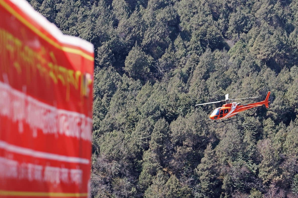 A file image shows a rescue helicopter flying in Olangchung Gola in Nepal (AFP via Getty Images)