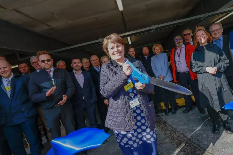 Chief Executive of UHNM Tracey Bullock cuts the ribbon to officially open the car park. -Credit:Stoke Sentinel