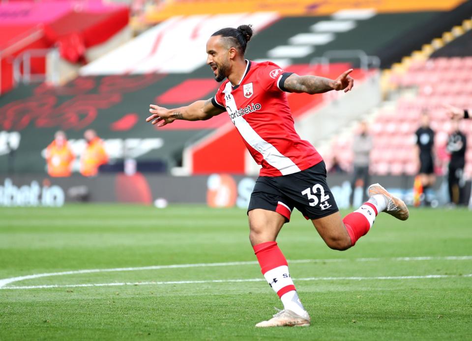 Theo Walcott celebrates after scoring for Saints (PA)