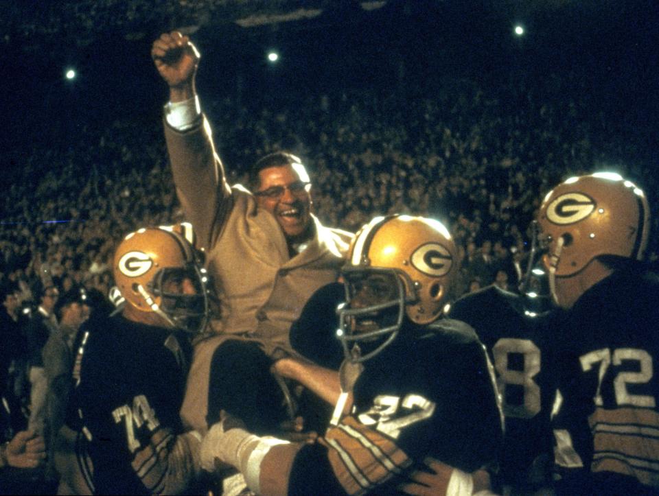 Coach Vince Lombardi is carried off the field after his Green Bay Packers beat the Dallas Cowboys, 34-27, in the NFL championship game Jan. 1, 1967, at the Cotton Bowl in Dallas. The Packers went on to beat the Kansas City Chiefs in the first Super Bowl.