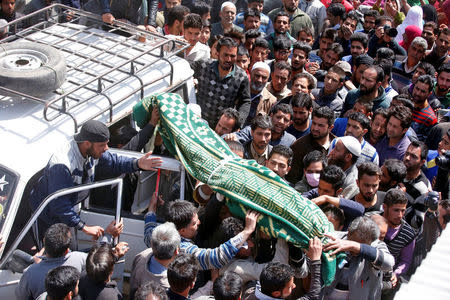 People carry the body of Ali Mohammed Dagga, a driver who according to local media reports died after he was hit by a stone while driving his vehicle during clashes between Kashmir demonstrators and Indian police on Monday evening during a protest against recent civilian killings, for his funeral in Srinagar, India April 11, 2017. REUTERS/Danish Ismail