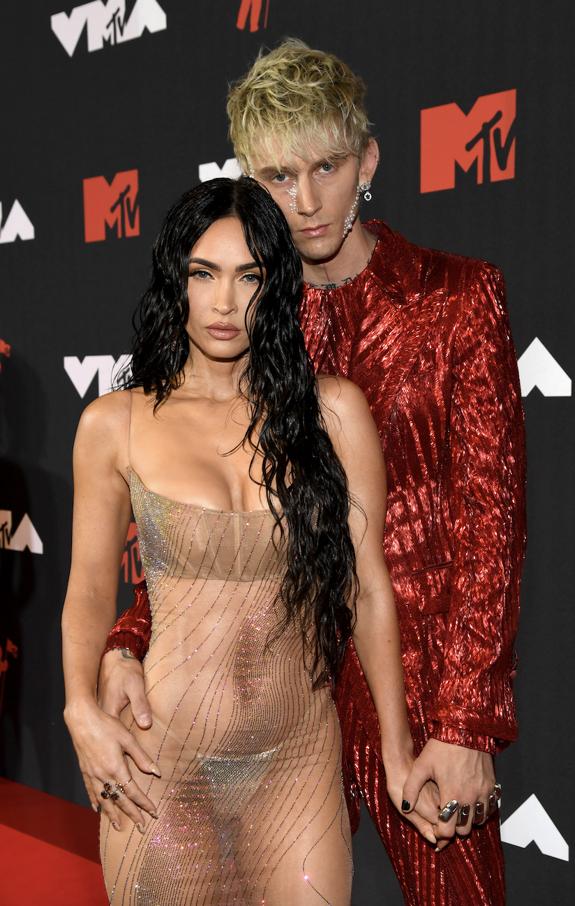 The couple holding hands on the red carpet