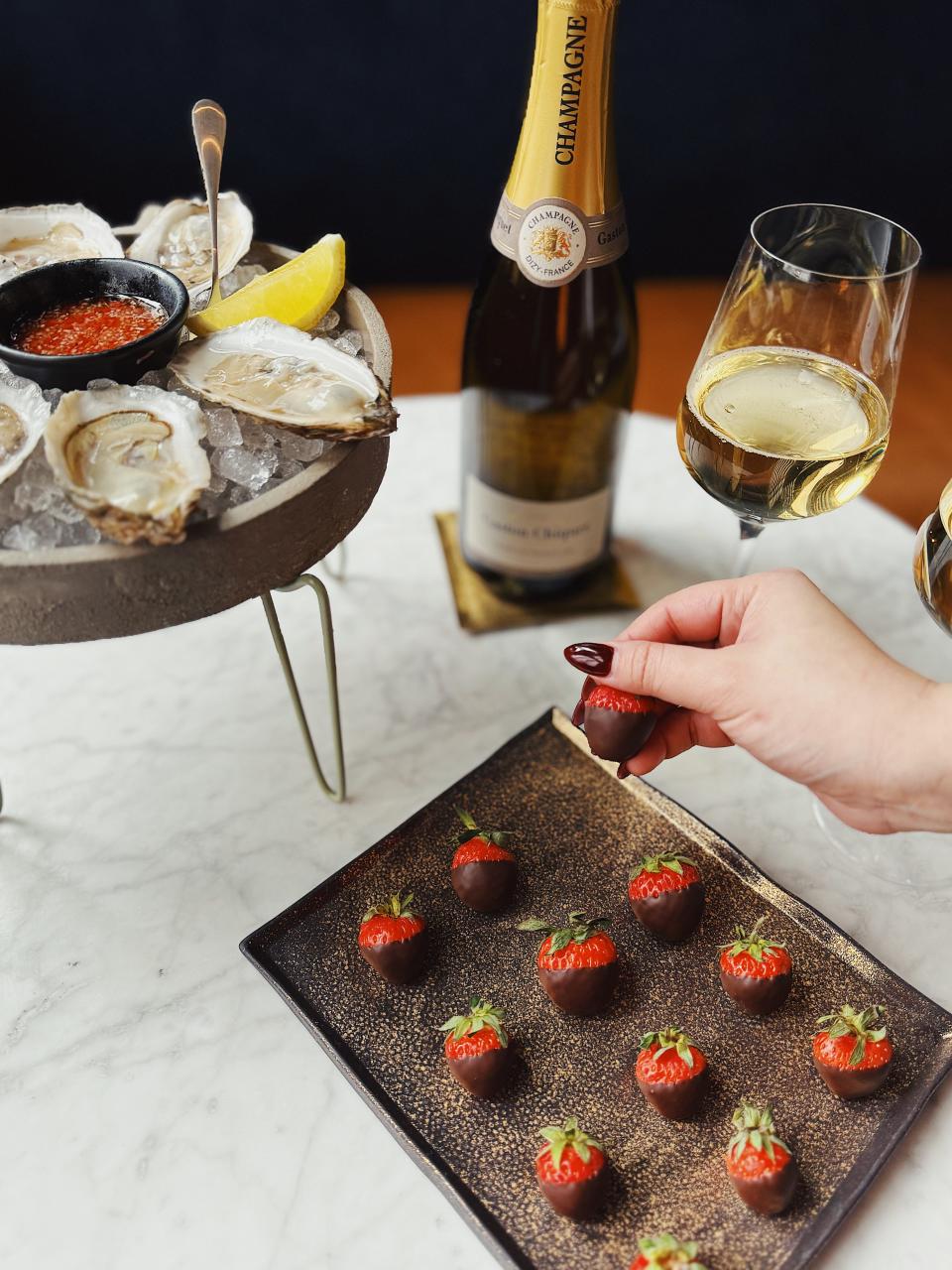 Oysters, chocolate covered strawberries and champagne offered as part of the "Lover's Lounge" Valentine's Day celebration at Heirloom Kitchen at The St. Laurent.