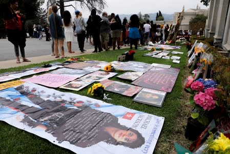 Fans place memorabilia around the Mausoleum as they gather at Forest Lawn Cemetery ten years after the death of child star turned King of Pop, Michael Jackson, in Glendale, California