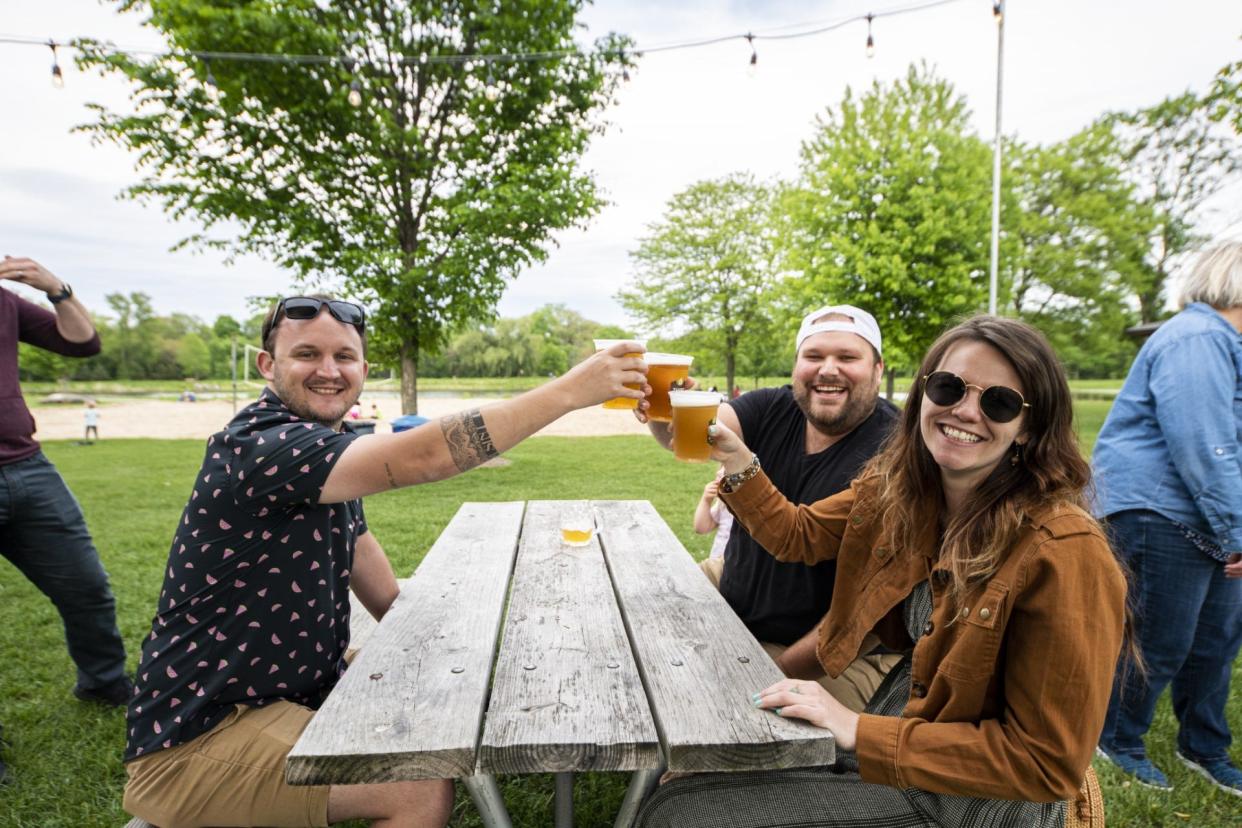 People enjoy some beer at The Elm Grove Beer Garden. Three Wisconsin brewers were named among the top 50 craft beer producers in the U.S. by a new report from the Brewers Association.