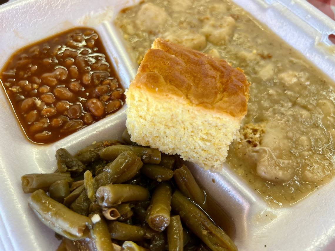 Chicken and dumpings, green beans and baked beans at MaMa E’s Bar-B-Que and Home Cooking, Aug. 2, 2023. Bud Kennedy/bud@star-telegram.com