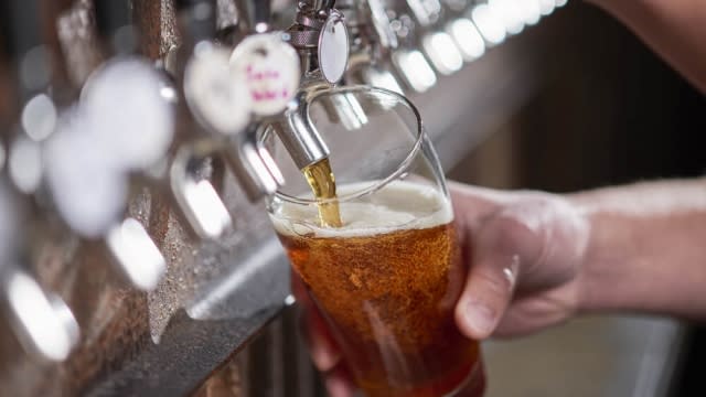 Craft beer poured into a pint glass.