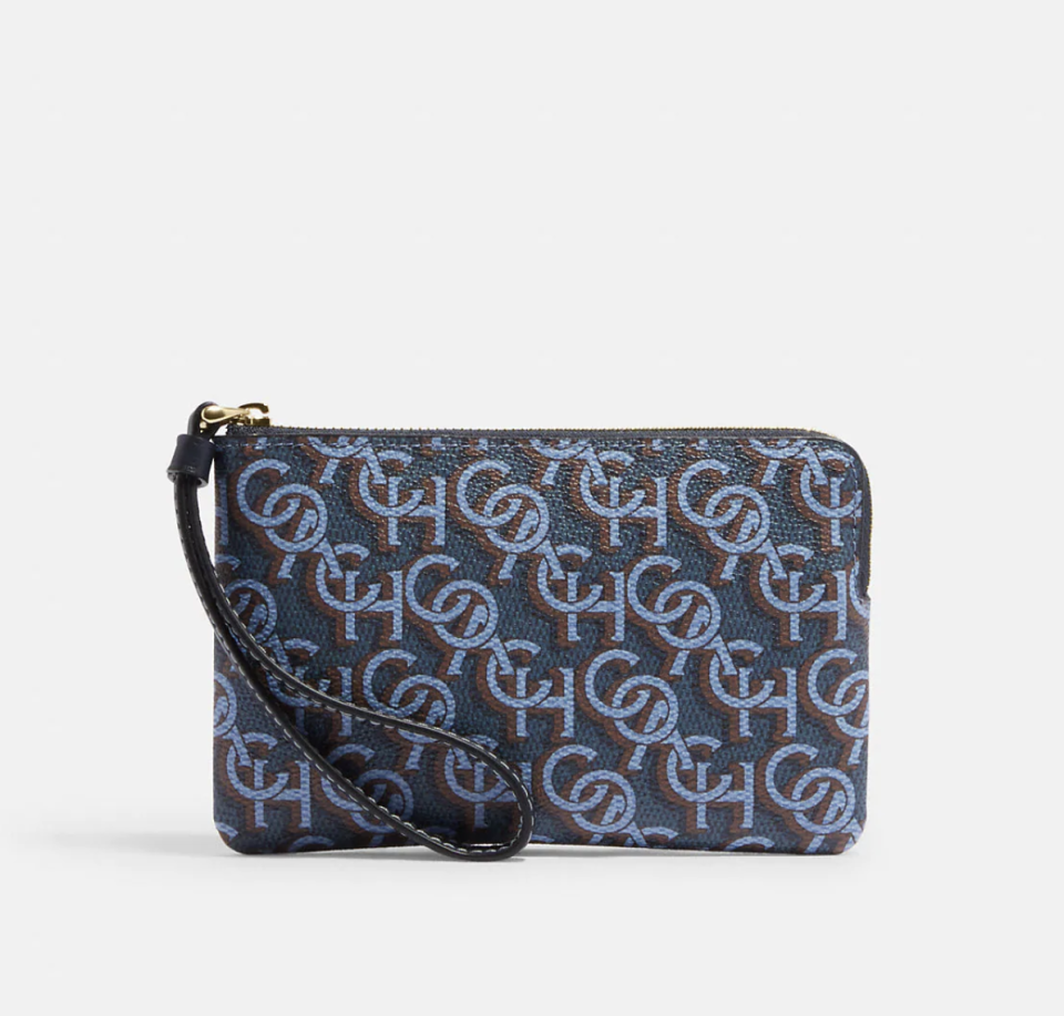 Corner Zip Wristlet With Coach Monogram Print in gold/navy (Photo via Coach Outlet)