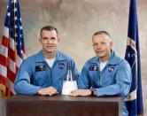 Astronauts David R. Scott (L), Pilot; and, Neil A. Armstrong, Command Pilot, pose with model of the Gemini Spacecraft after being selected at the crew for the Gemini VIII mission in this undated NASA handout photo.