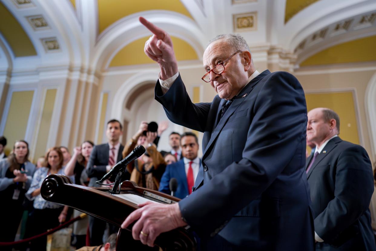 Senate Majority Leader Chuck Schumer, D-N.Y., answers questions on the border security talks as he meets reporters following a Democratic caucus meeting, at the Capitol in Washington, Wednesday, Jan. 31, 2024. (AP Photo/J. Scott Applewhite) ORG XMIT: DCSA103