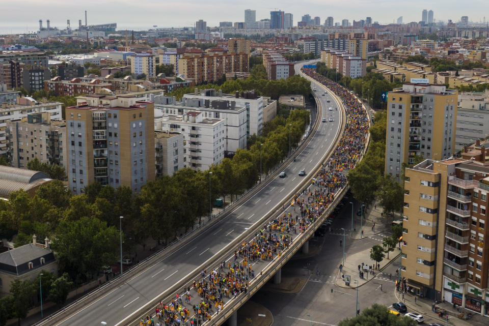 Pro-independence demonstrators march into the city on the fifth day of protests in Barcelona, Spain, Friday, Oct. 18, 2019. (Photo: Emilio Morenatti/AP)