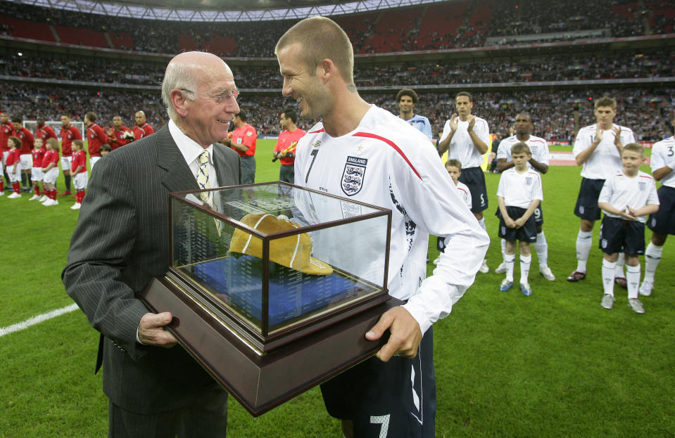 Sir Bobby Charlton presenting David Beckham of England with his 100th cap. (Getty)