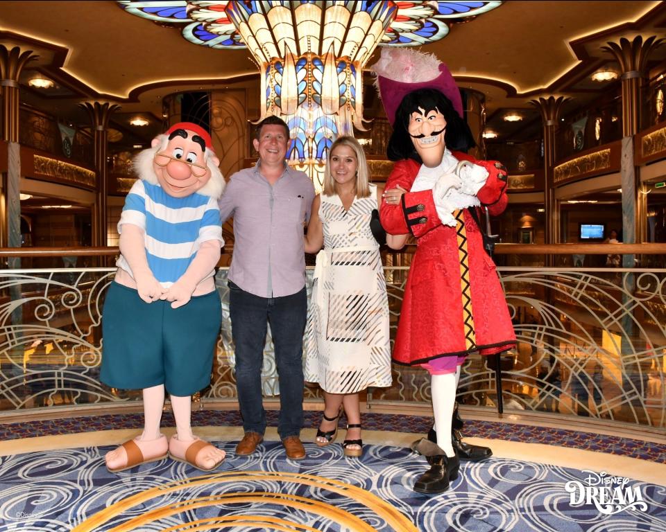 The author and her husband with Captain Hook and Smee