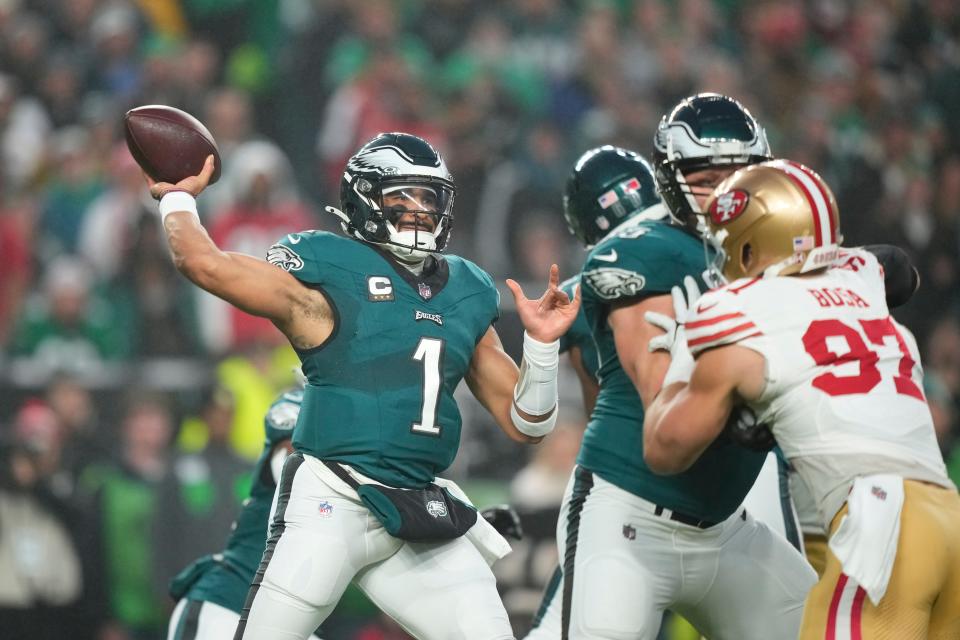 Philadelphia 's Jalen Hurts (1) throws a passIn actIn of an NFL football game, Sunday, Dec. 3, 2023, In Philadelphia, on Sunday, Dec. 3, 2023.