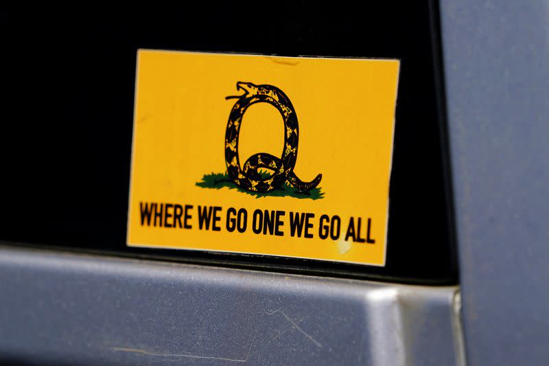 FILE PHOTO: A sticker that references the QAnon slogan is seen on a truck that participated in a caravan convoy in U.S. state of Georgia