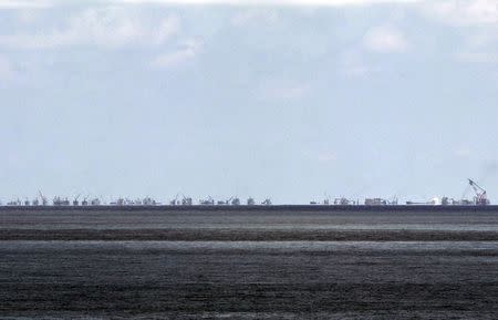 The alleged on-going land reclamation of China at Subi reef is seen from Pagasa island (Thitu Island) in the Spratlys group of islands in the South China Sea, west of Palawan, Philippines, May 11, 2015. REUTERS/Ritchie B. Tongo/Pool