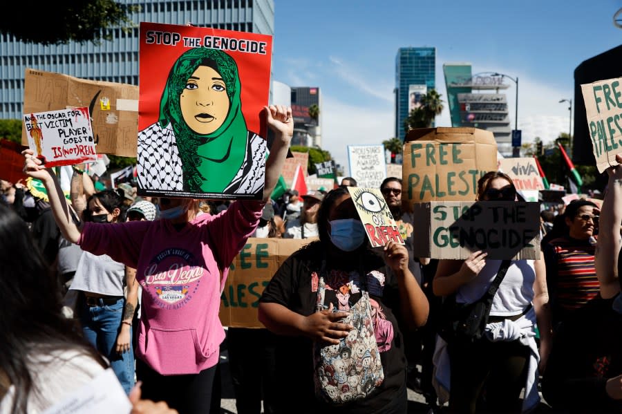 Protesters gather during a demonstration in support of Palestinians calling for a ceasefire in Gaza as the 96th Academy Awards Oscars ceremony is held nearby, Sunday, March 10, 2024, in the Hollywood section of Los Angeles. (AP Photo/Etienne Laurent)