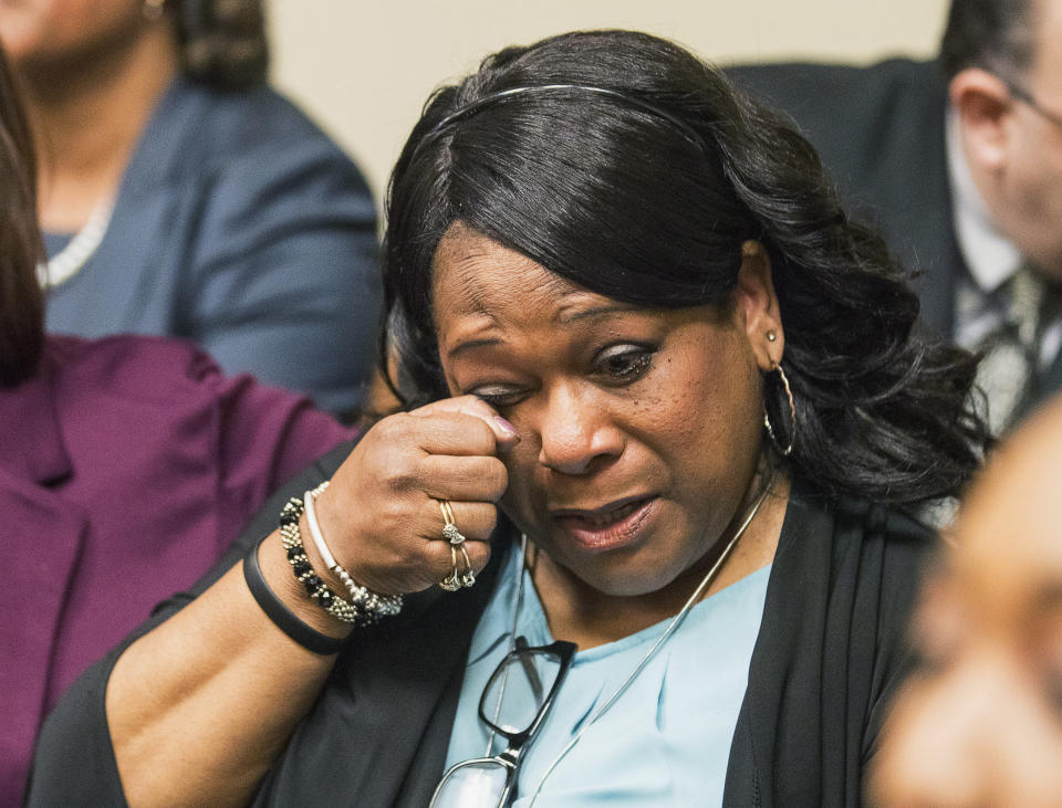 Carolyn Giummo reacts as the jury reads the verdict for the Robert "Chip" Olsen trial in front of DeKalb County Superior Court Judge LaTisha Dear Jackson at the DeKalb County Courthouse in Decatur, Ga., Monday, Oct. 14, 2019. A former Georgia police officer who fatally shot Giummo's son, an unarmed, naked man, was found not guilty of murder on Monday, but was convicted of aggravated assault and other charges that could potentially send him to prison for more than 30 years. (Alyssa Pointer/Atlanta Journal-Constitution via AP, Pool)