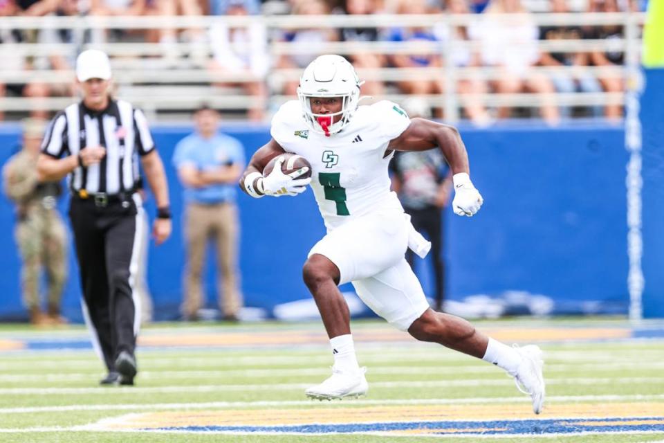 Cal Poly running back Mark Biggins (4) rushes the ball in the first half of Cal Poly’s 59-3 loss to San Jose State at CEFCU Stadium in San Jose on Sept. 9, 2023.