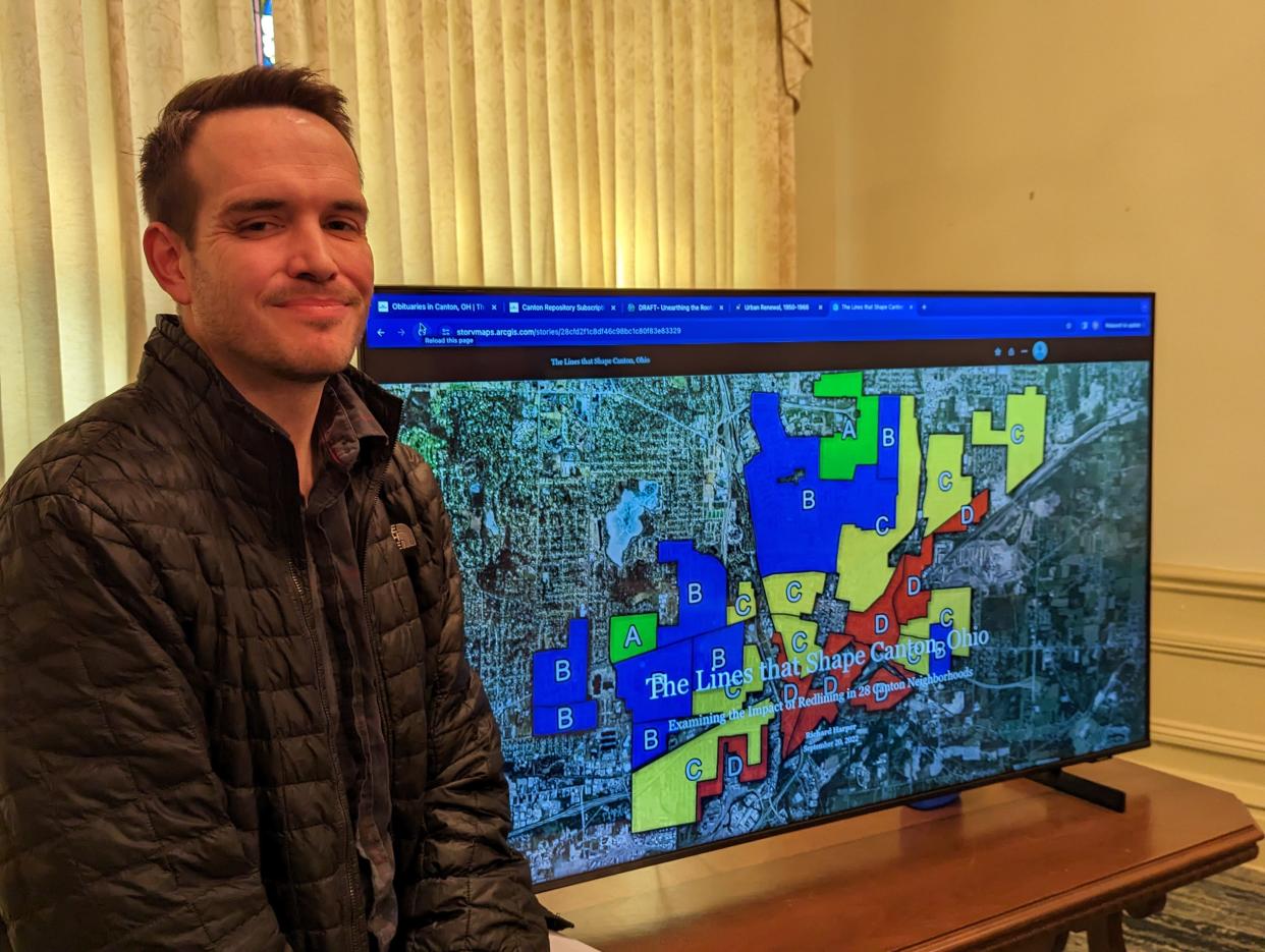 Richard Harper stands in front of a computer map showing how home loans were handed out in Canton. The process of redlining helped shape city neighborhoods.