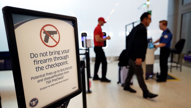 A sign is posted to remind travelers not to bring firearms through the security checkpoint at the Salt Lake City International Airport in Salt Lake City on Tuesday, Sept. 19, 2023.