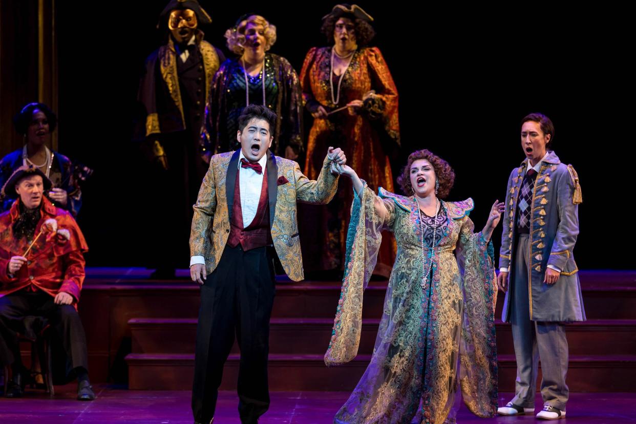 At center, from left: Kang Wang, Kathryn Lewek and Emily Fons, along with the Palm Beach Opera Chorus, in a scene from Offenbach's "The Tales of Hoffmann," at Palm Beach Opera. The final performance is this afternoon at 2 p.m.