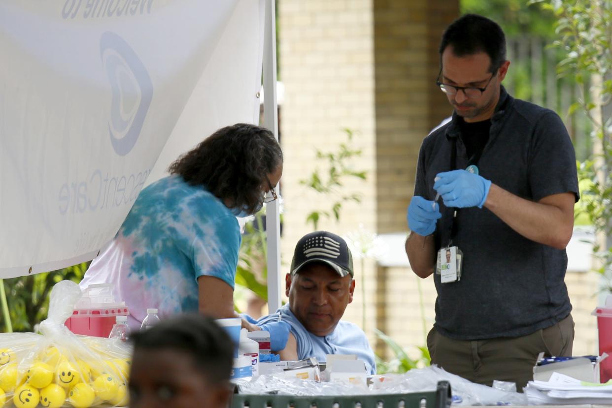 A man gets vaccinated against COVID-19