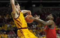 Iowa State guard Caleb Grill (2) fouls St. John's guard Montez Mathis (10) on a shot during the first half of an NCAA college basketball game, Sunday, Dec. 4, 2022, in Ames, Iowa. (AP Photo/ Matthew Putney)
