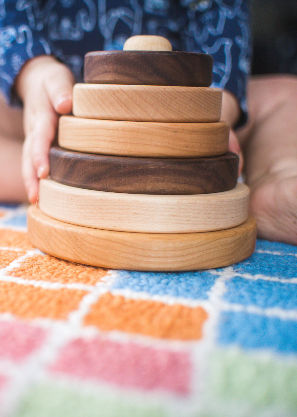 This image released by Etsy shows wooden circle stackers for infants and toddlers by Etsy seller, SouthBendWorks. (Etsy via AP)