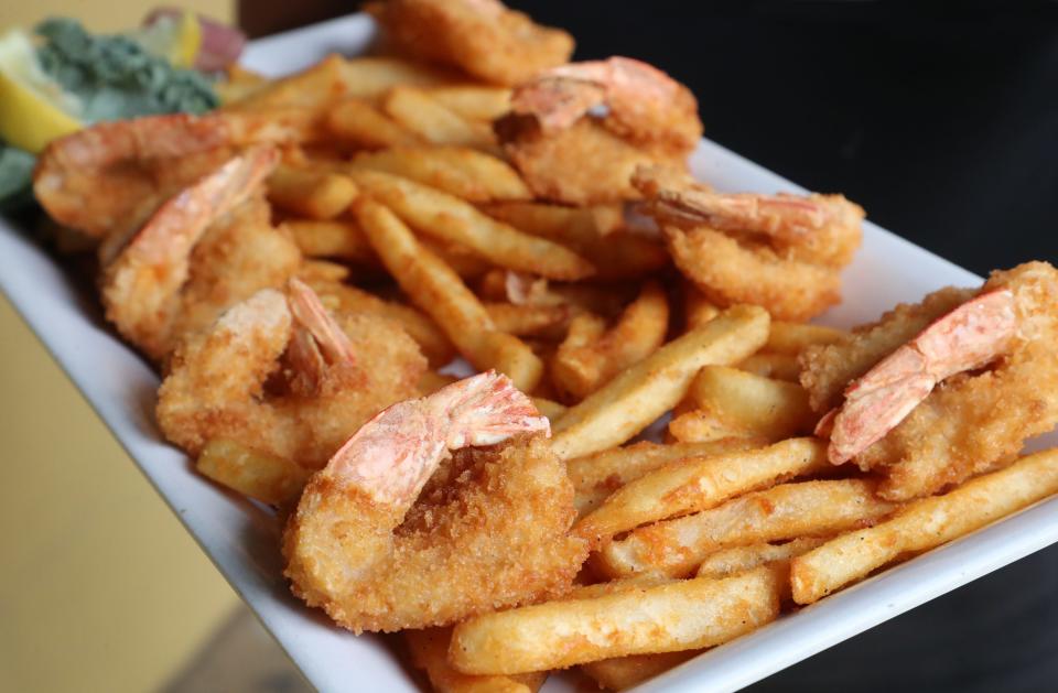 Fried shrimp and French fries are served up at the Golden Lion in Flagler Beach.
