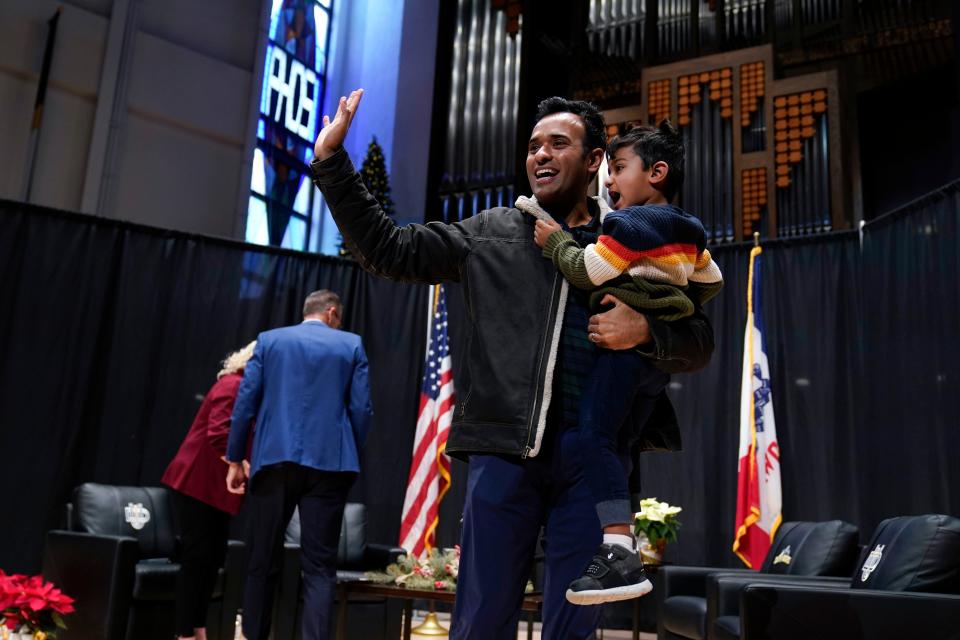 Republican presidential candidate businessman Vivek Ramaswamy holds his son Karthik as he walks off stage during U.S. Rep. Randy Feenstra's, R-Iowa, Faith and Family with the Feenstras event, Saturday, Dec. 9, 2023, in Sioux Center, Iowa.
