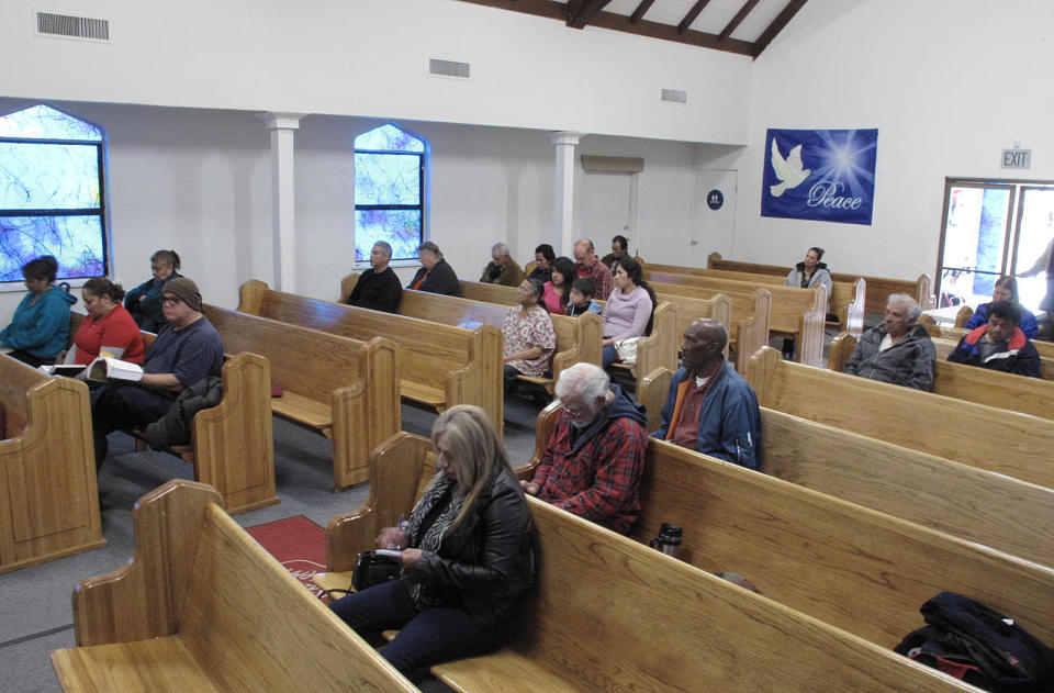 In this Thursday Jan. 30, 2014 photo, residents attend a devotional at the Salvation Army in Los Banos, Calif. After the spiritual service, they each collect a bag of free food. Leaders at the Los Banos Salvation Army fear that the state’s drought will cause more people to need food this year because they won’t have jobs on Central Valley farms. (AP Photo/Scott Smith)