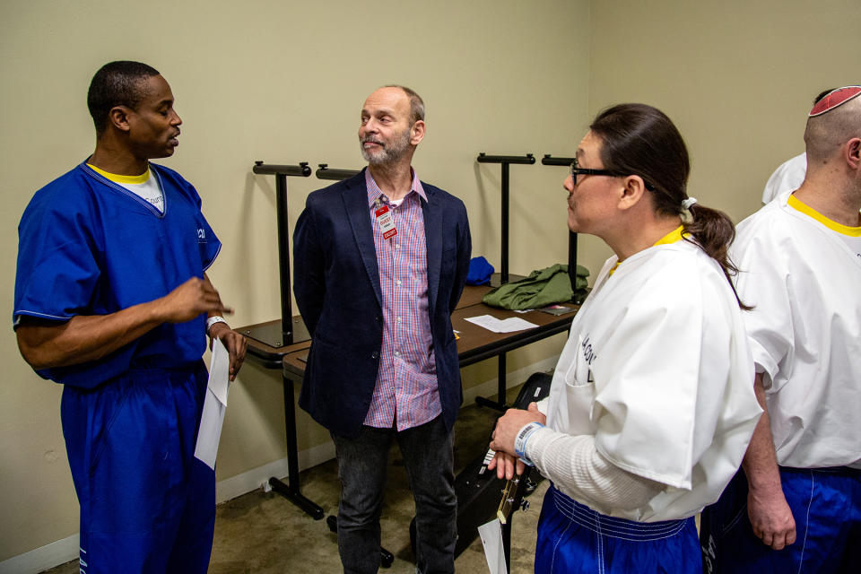 Guitarist Wayne Kramer (center), formerly of the MC5, talks with inmates at Los Angeles County Jail, after giving out certaificates from Jail Guitar Doors. The program brings intruments and music instruction into prisons around the country.