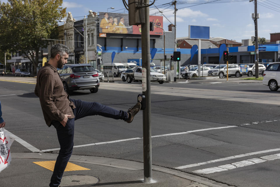 While automated pedestrian crossing have rolled out across Australia, some people may still have the urge to hit the button, but maybe not with their hands amid the coronavirus pandemic. Source: Supplied/Nathan K Davis