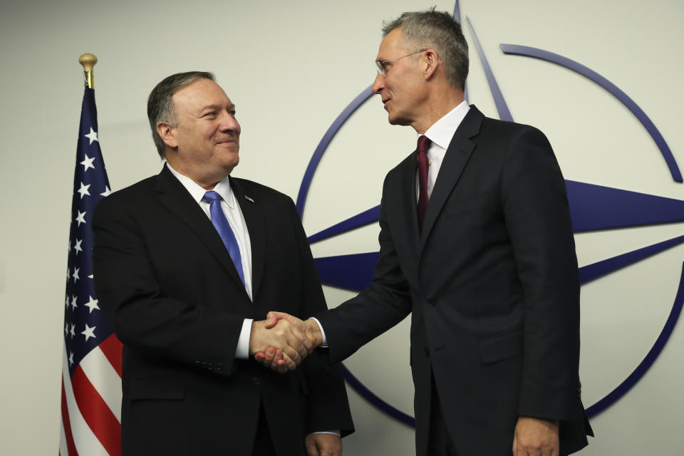 U.S. Secretary of State Mike Pompeo, left, shakes hands with NATO Secretary General Jens Stoltenberg after arriving for a NATO Foreign Ministers meeting at the NATO headquarters in Brussels, Wednesday, Nov. 20, 2019. (AP Photo/Francisco Seco, Pool)