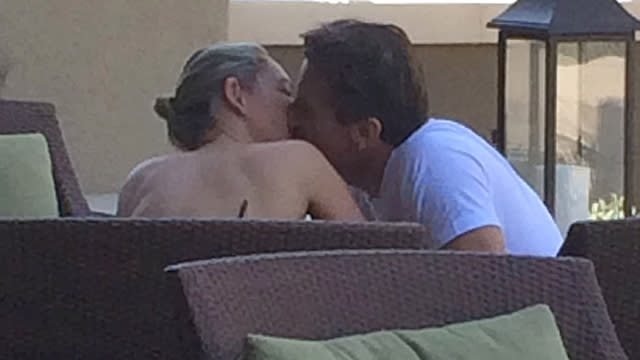 Despite <em>Shark Tank </em>star Robert Herjavec's coy answer last week when asked by <em>Dancing With the Stars</em> host Tom Bergeron if he and his partner, dancer Kym Johnson, were an item off-screen, there's no denying the rumors now! The cute couple -- who were actually eliminated from the competition last week -- was spotted showing tons of PDA during a vacation in Palm Springs, Calif., over the weekend. According to eyewitnesses, Kym and Robert "couldn't keep their hands off each other," making out and holding hands. "Robert is very attentive to Kym," another onlooker tells ET. "They were not trying to hide their affection, not caring at all who noticed." Movi Inc. Movi Inc. PHOTOS: The Complete List -- 'DWTS' Winners ET chatted with the 51-year-old multimillionaire tech mogul and the 38-year-old pro dancer's <em> DWTS </em>season 20 co-stars on Monday, who couldn't be happier for the two. "I think it was instant," Derek Hough told ET about their connection. "When I found out they were dancing together I was like, first of all, that's the man of her dreams. The fact that he felt the same about her -- I couldn't be happier for them." "Oh I love it and I think we all kind of sensed it from the very, very beginning," singer/songwriter Riker Lynch echoed. According to judge Carrie Ann Inaba, their romance is "like a fairy tale." "I think that they are incredible," she gushed. "When they danced together their chemistry was so exciting." VIDEO: Who Was In on Noah Galloway's 'DWTS' Proposal? Earlier this month, a source told ET that the two have actually been dating since the beginning of the show, and that they "are inseparable and madly in love." Watch the video below for more on one of <em>DWTS</em>' most adorable couples.