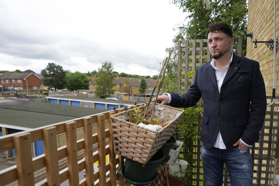 Dominic Watters, a single dad and founder of the Food is Care campaign, poses for a photograph outside his home in Canterbury, England, Monday, June 10, 2024. Since calling a general election, British Prime Minister Rishi Sunak has been at pains to repeat a key message on the campaign trail: The economy is turning a corner, inflation is down, and things are looking up. That’s not the reality for millions across the U.K. still feeling the squeeze from high food, energy and housing prices. (AP Photo/Kin Cheung)