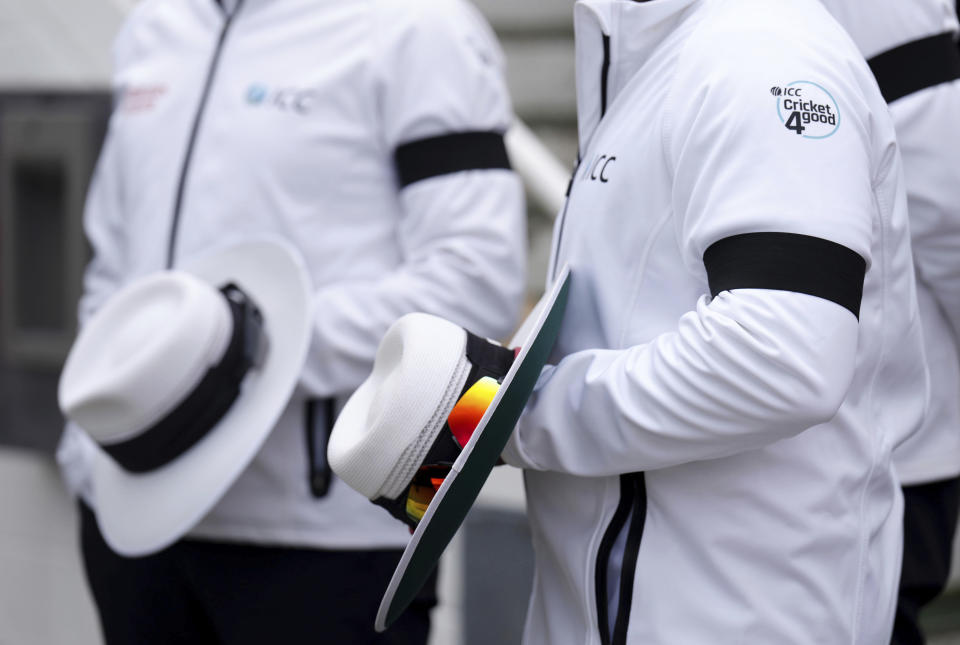 Umpires wearing black armbands on day three of the third LV= Insurance Test match at the Kia Oval, following the death of Queen Elizabeth II, Saturday September 10, 2022. (John Walton/PA via AP)