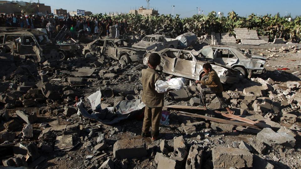 TOPSHOTS

Yemenis stand at the site of a Saudi air strike against Huthi rebels near Sanaa Airport on March 26, 2015, which killed at least 13 civilians. Saudi warplanes bombed Huthi rebels in Yemen, launching a military intervention by a 10-nation coalition to prevent the fall of embattled President Abedrabbo Mansour Hadi.  AFP PHOTO / MOHAMMED HUWAIS